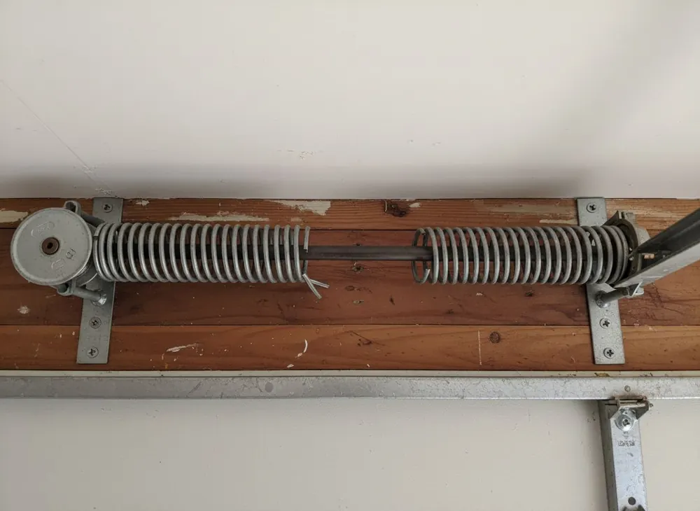 Snapped torsion spring with a visible gap in the coil